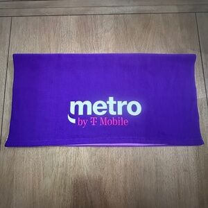 T-Mobile Tuesdays Blanket in purple, pink, and white 100% polyester